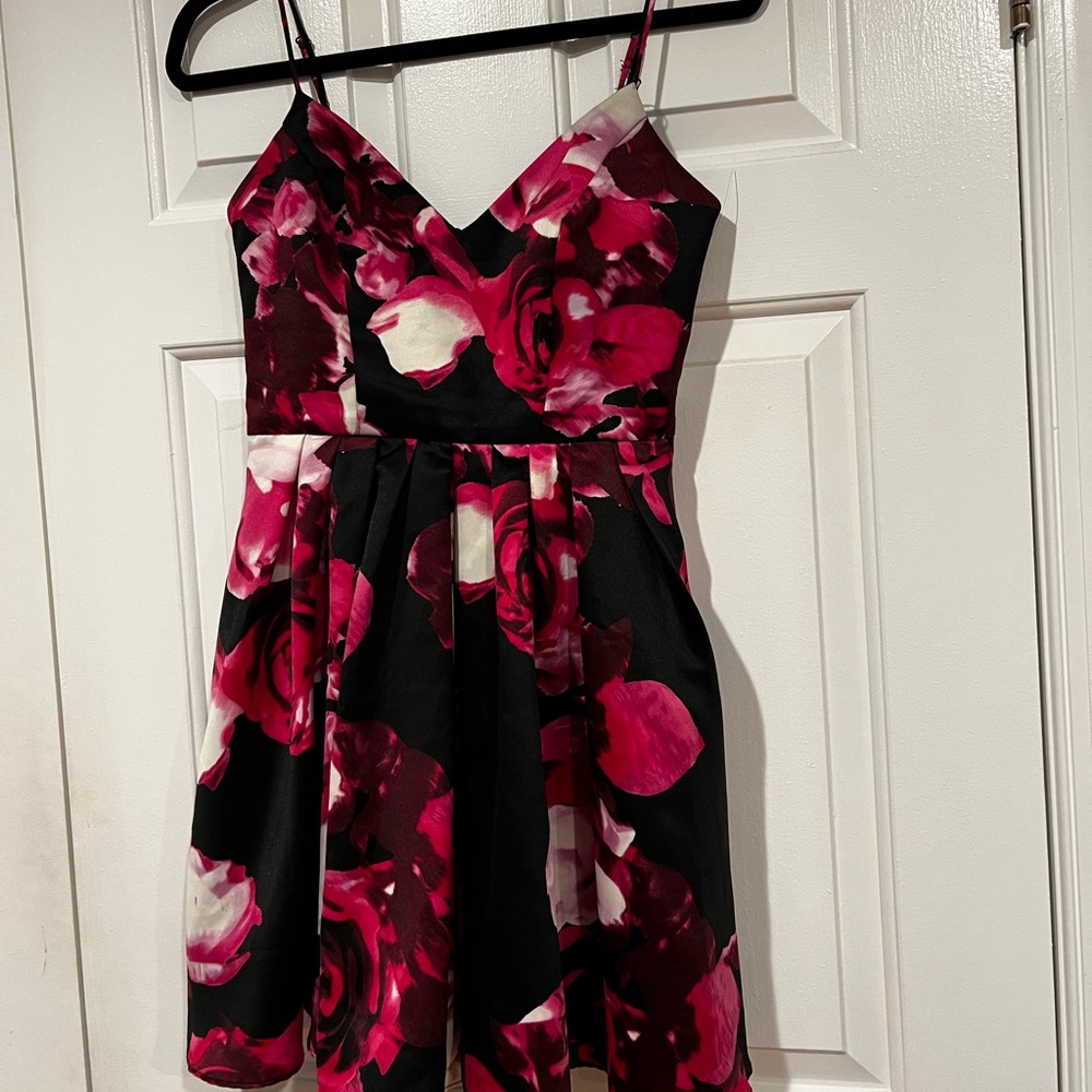 Jump Apparel floral on black spaghetti strap cocktail dress.